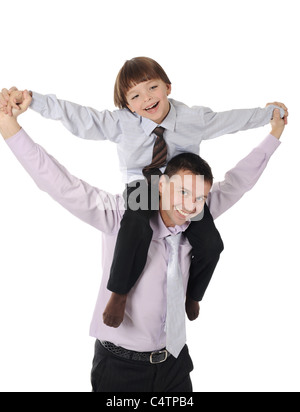 lucky son sitting on his father stretches Stock Photo