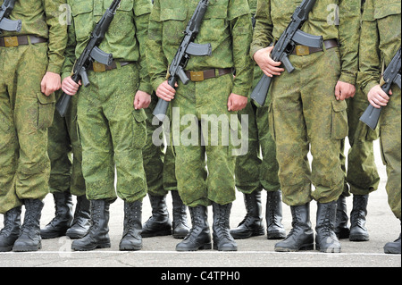 russian soldiers in camouflage suit with machine guns Kalashnikov Stock Photo