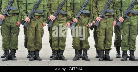 russian soldiers in camouflage suit with machine guns Kalashnikov Stock Photo