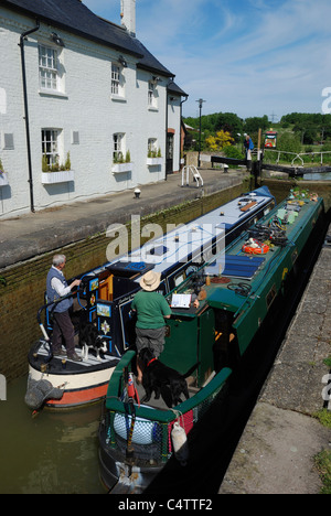 Two narrowboats in Grove Lock on the Grand Union Canal, Grove, Leighton Buzzard, Bedfordshire, England. Stock Photo
