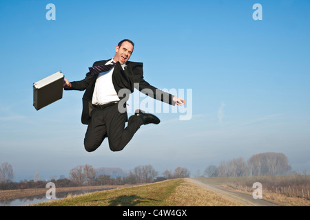 Businessman Jumping Stock Photo