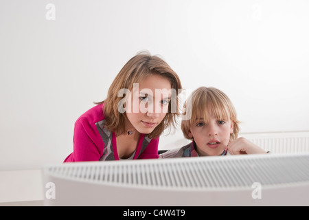 Teenagers using Computer Stock Photo