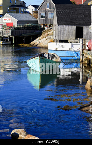 Fishing hut and boat at the idyllic fishing village of Peggys Cove on the eastern shore of St. Margarets Bay, Nova Scotia, Canada Stock Photo