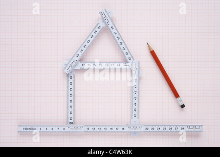 Folding Ruler in Shape of House and Pencil Stock Photo