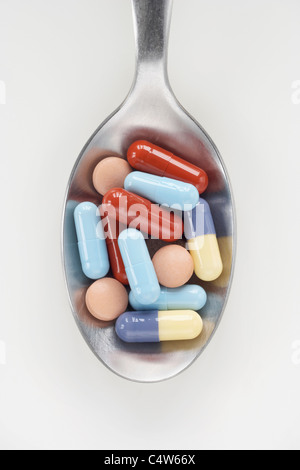 Pills on Spoon Stock Photo