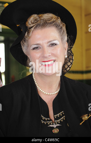 Portrait of a pretty woman dressed in 1940s outfit Stock Photo