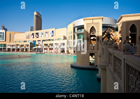 The Dubai Mall and Souk al Bahar bridge over the Burj Khalifa lake in Downtown Dubai, United Arab Emirates, UAE