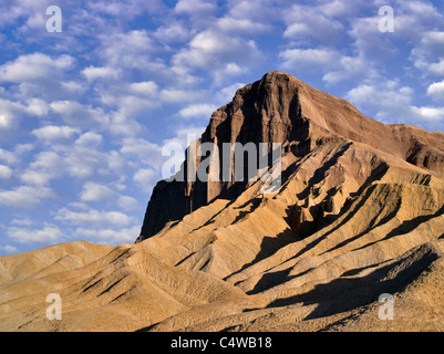 Manly peak as seen from Golden Canyon Trail. Death Valley National Park, California. Sky has been added. Stock Photo