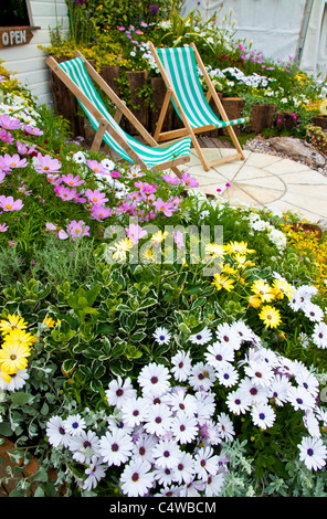Deck chairs in garden, England, UK Stock Photo