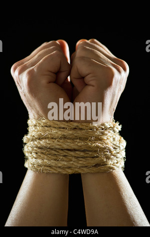 Studio shot of tied hands Stock Photo