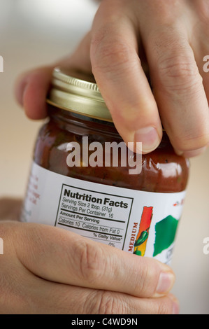 Man opening jar Stock Photo