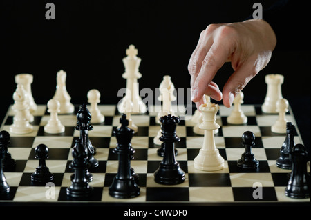 Close-up of man's hand playing chess Stock Photo