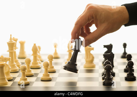 Close-up of man's hand playing chess Stock Photo