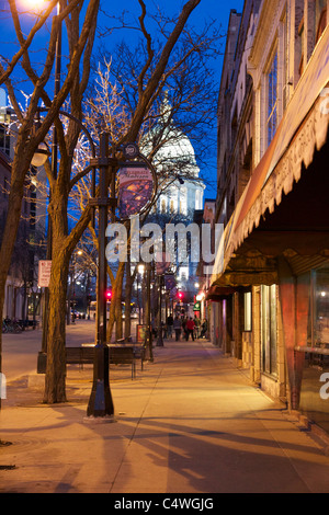 State Street at twilight with capitol building in background. Madison, Wisconsin. Stock Photo
