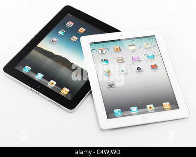 White Apple iPad 2 and black iPad tablet computers. Isolated on white background. Stock Photo