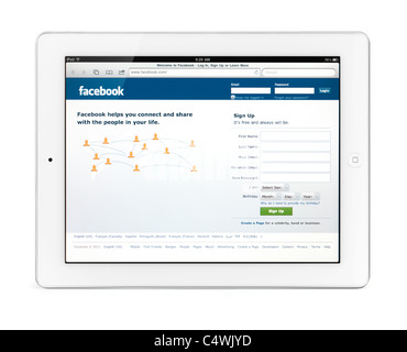 Apple iPad 2 tablet computer with Facebook social networking web site front page on its display. Isolated on white background.
