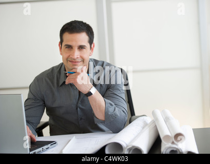 USA, New Jersey, Jersey City, portrait of architect using laptop Stock Photo