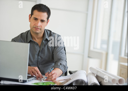 USA,New Jersey,Jersey City,architect using laptop Stock Photo