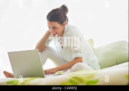 Young attractive woman using laptop Stock Photo