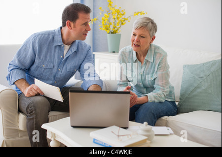 USA,New Jersey,Jersey City,Senior mother and adult son using laptop Stock Photo