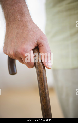 USA,New Jersey,Jersey City,Close-up of senior man's hand on cane Stock Photo