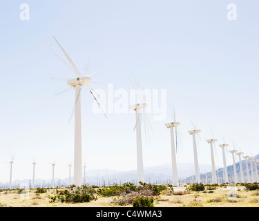 USA, California, Palm Springs, Coachella Valley, San Gorgonio Pass, Wind turbines with mountains in background Stock Photo