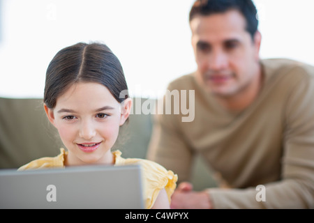 USA,New Jersey,Jersey City,daughter (8-9) and father using laptop Stock Photo