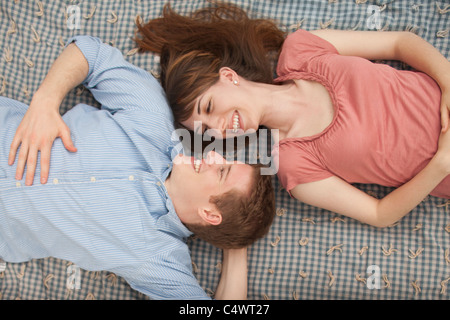 USA,Utah,Provo,Young couple lying on blanket Stock Photo