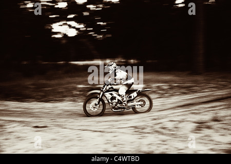 USA, Texas, Austin, Cross motorcyclist on sandy track Stock Photo