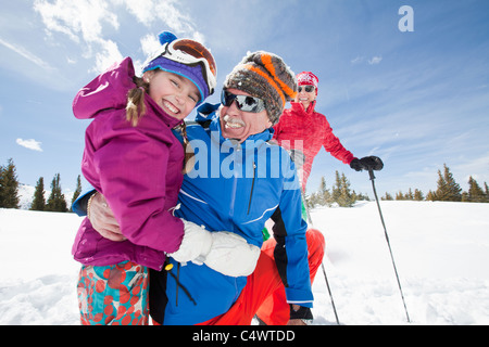 USA, Colorado, Telluride, Grandparents with girl (10-11) posing during ski holiday Stock Photo
