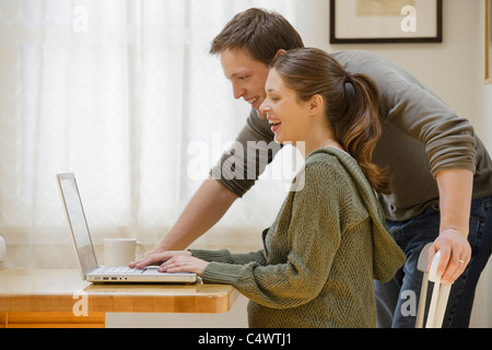 USA, California, Los Angeles, couple using laptop at home Stock Photo
