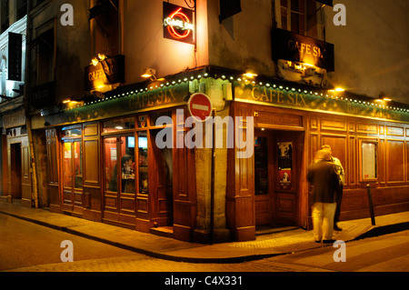 The narrow streets of St Germain in Paris by night Stock Photo