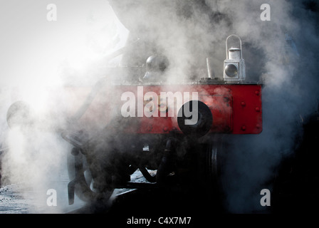 Front of steam engine engulfed in steam at Gloucestershire Warwickshire Railway,GWR. Toddington, Gloucestershire, England UK. Stock Photo