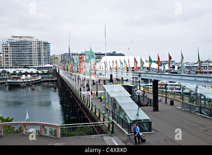 Pyrmont Bridge over Cockle Bay in Darling Harbour With FlagsSydney New South Wales Australia Stock Photo