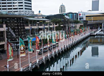 The Charming Cockle Bay Wharf with Shops and Tourist Train at Darling Harbour Sydney New South Wales NSW Australia Stock Photo