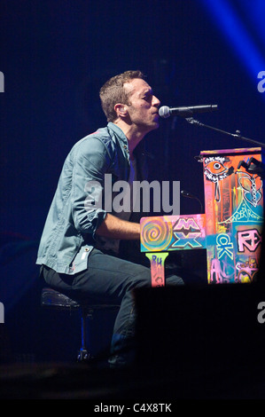 Chris Martin from Coldplay performing on the Pyramid Stage at Glastonbury festival 2011. Stock Photo