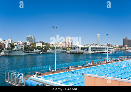 Large Open Air Swimming Pool in Woolloomooloo Bay with The Wharf Shopping Mall and Naval Dockyard Sydney NSW Australia Stock Photo