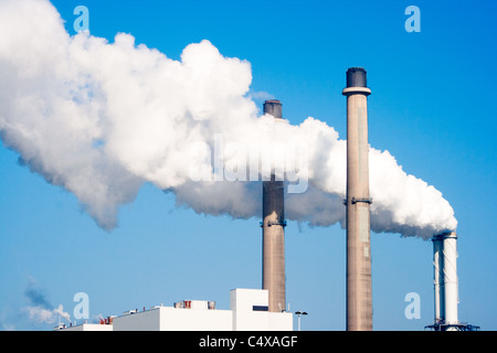 Smoke emission from factory pipes Stock Photo