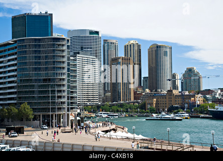 The Sydney Skyline and Financial Centre with Circular Quay Ferry Terminal and Tourists From Sydney Opera House NSW Australia Stock Photo