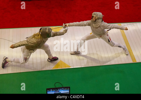 Mariel Zagunis (USA) competing against Anna Limbach (GER) the 2011 New York Saber World Cup. Stock Photo
