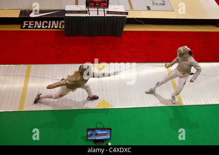 Mariel Zagunis (USA) competing against Anna Limbach (GER) the 2011 New York Saber World Cup. Stock Photo