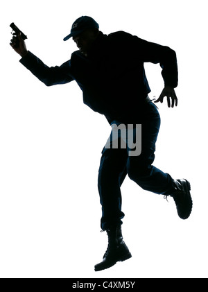 Full length of an afro American police officer running with a handgun on white isolated background Stock Photo