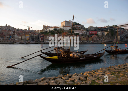 Porto, Two Port Wine Barges And The Ribeira District At sunset. Stock Photo