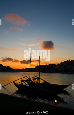 Porto, Two Port Wine Barges And The Ribeira District At sunset. Stock Photo