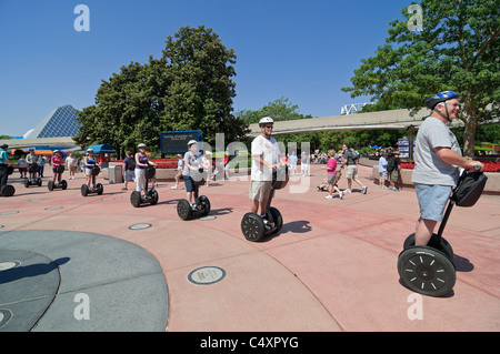 Epcot Center Orlando Florida Segway tour participants follow the leader through the theme park Stock Photo