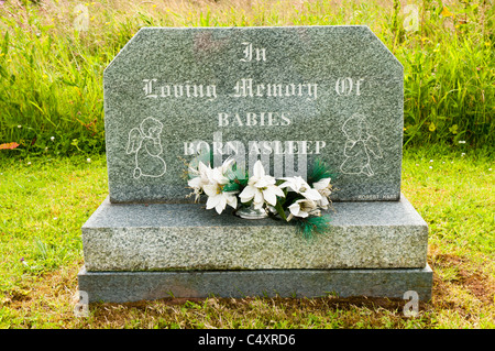 Small gravestone remembering 'babies born asleep' Stock Photo