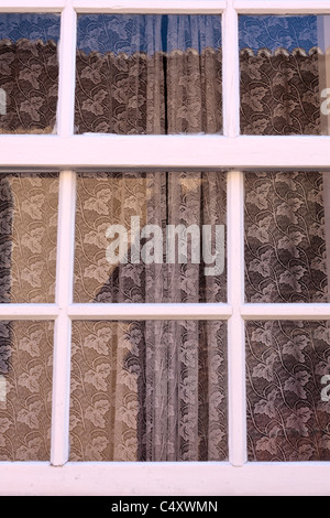 Old style wooden window and lace curtain in La Laguna Tenerife Canary Islands Spain Stock Photo