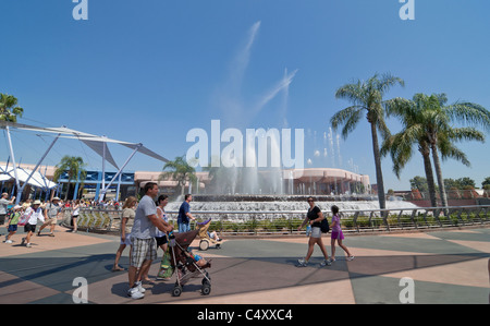 Epcot Theme Park and Center Orlando Florida visitors stroll by the  Leaping Fountains area of the park Stock Photo