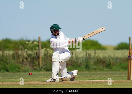Showing the follow through of a batsman playing a shot. Stock Photo