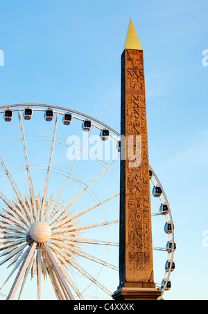 Obelisk and big wheel, Paris, France Stock Photo